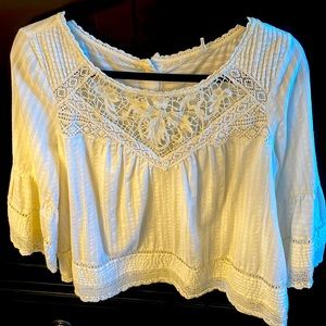 Appliqué lace cotton blouse with bell sleeve and button up back details